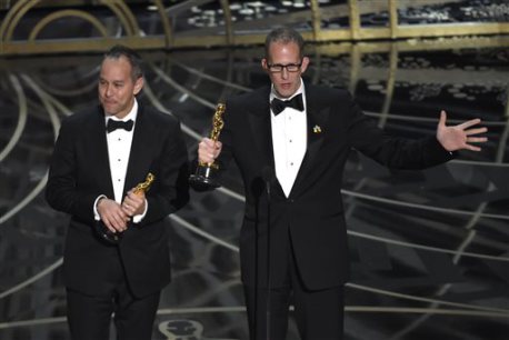 Jonas Rivera, left, and Pete Docter accept the award for best animated feature film for “Inside Out". (Photo by Chris Pizzello/Invision/AP) Inside Out, Bear Story Win at 2016 Oscars